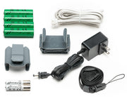 Collection of electronic accessories including batteries, cables, and a power adapter on a white background.